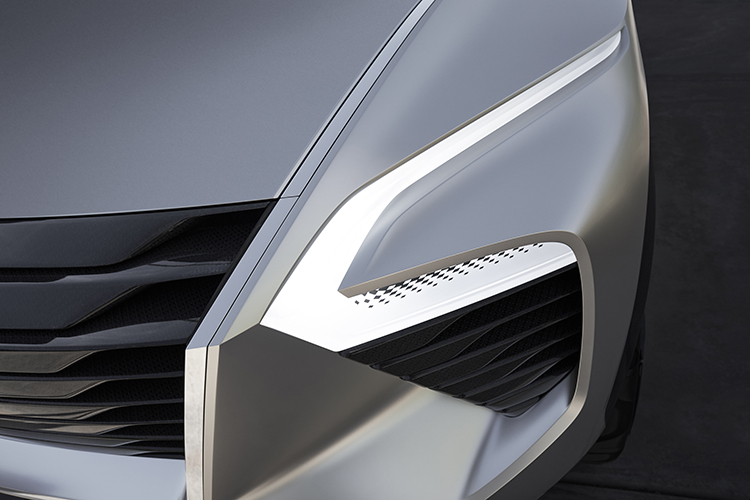 photo of Xmotion Concept's left front grille, fascia and boomerang headlamps.