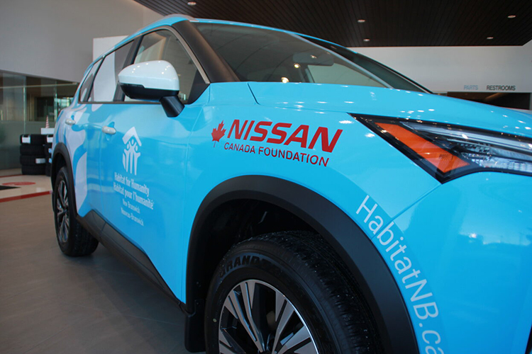 Close up of Nissan Canada Foundation and Habitat for Humanity NB branded Nissan Rogue