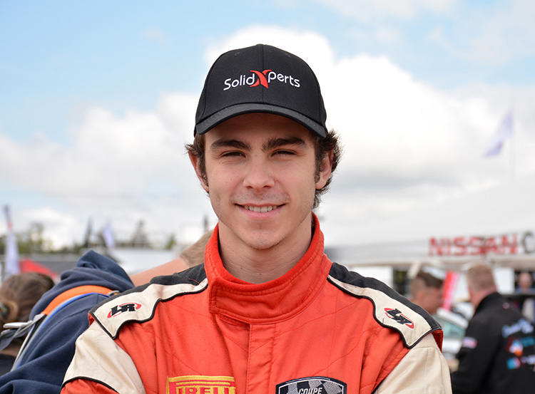 A young man in a Nissan Micra Cup racing uniform.