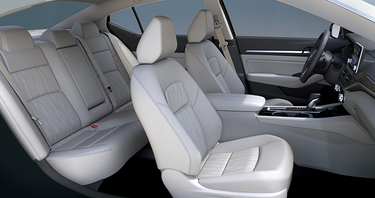 The interior of a Nissan Altima, showing all five seats