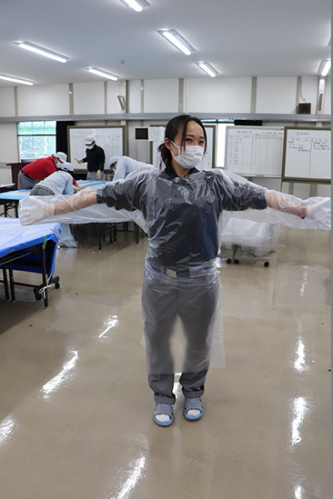 Nissan employee try on the finished medical gown
