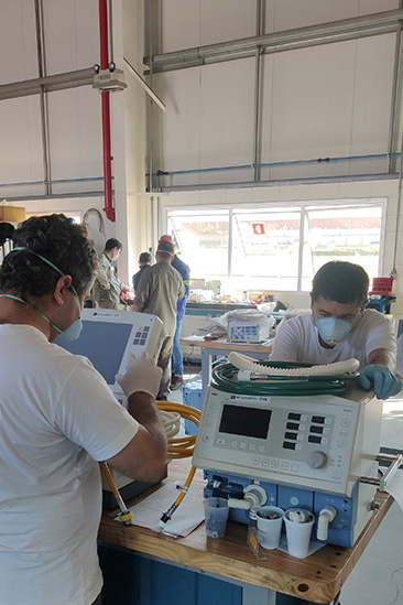 Nissan workers in Brazil repairing ventilators